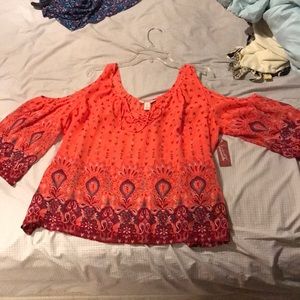 Shirt with shoulder cut outs and laced up top